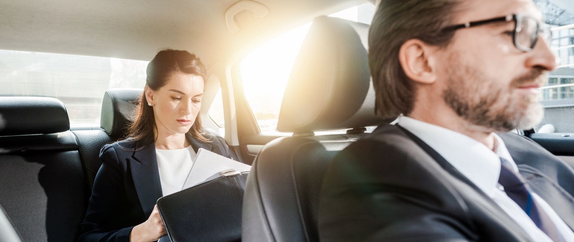 Woman working in the back of a car